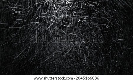 Long-exposure shot of severe snowstorm with intense motion blur, blowing snow and low visibility. isolated on the black background.