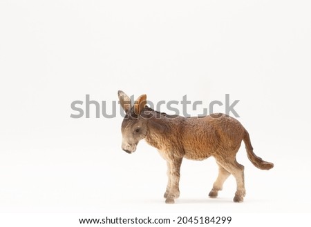 Realistic plastic toy, donkey, isolated on a white background.