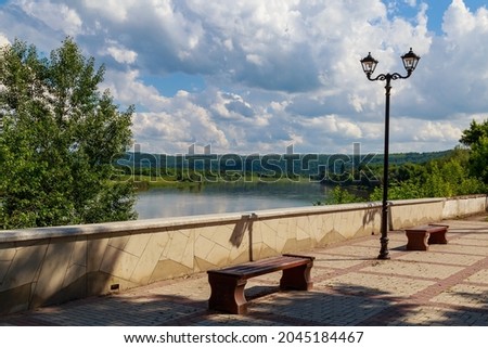 City embankment of the river. Urban and nature, background with copy space for text or lettering.