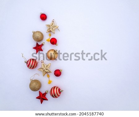 bright trinkets, Christmas balls, snowflakes and stars in the snow. christmas decorations