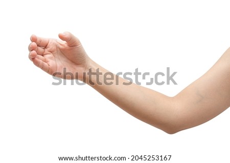 Close up woman hand holding something like a bottle or can isolated on white background with clipping path. Royalty-Free Stock Photo #2045253167