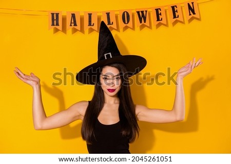 Photo of strong witch young lady with decoration wear black dress cap isolated on yellow color background