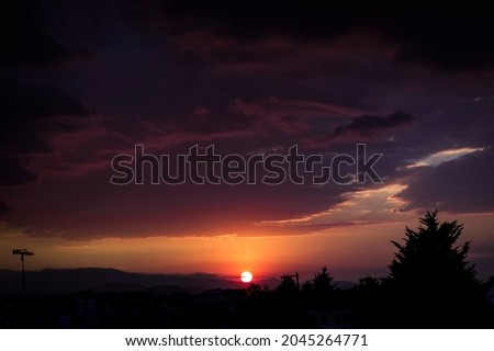 purple sunset with cloudy sky