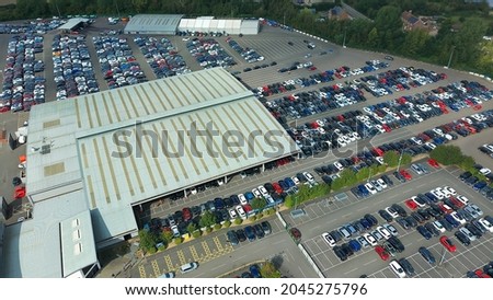 aerial view of huge and massive car park, drone footage Royalty-Free Stock Photo #2045275796