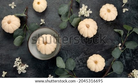 Pumpkin and eucalyptus harvest an black friday composition. Holiday season concept. Top view, flat lay