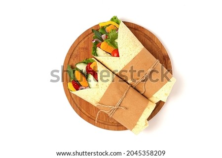 Tortilla wraps, with breaded chicken sticks with vegetables, burritos, on a white background, horizontal, no people,