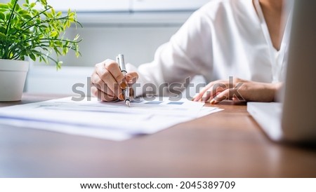 Auditor or internal revenue service staff, Business women checking annual financial statements of company. Audit Concept Royalty-Free Stock Photo #2045389709