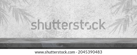 Loft style empty perspective cement floor or concrete shelf table on  abstract blur leaves the shadow background the panoramic banner can be used to display or montage your products