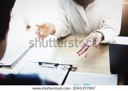 estate agent gives pen and documents agreement with customer to sign contract. Concept agreement.