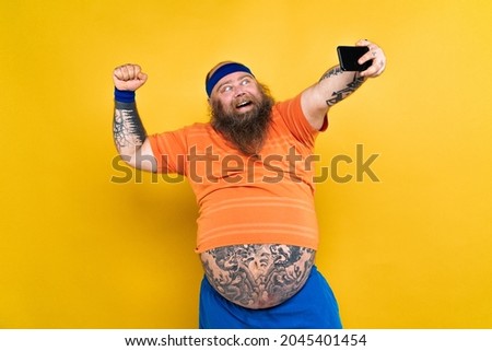 Funny fat man doing some sport exercises - Overweight man having weight issue and tries to start diet and sport, funny character