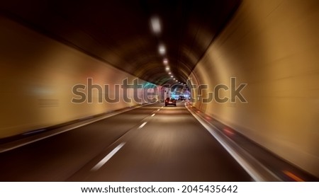 Car rides through the tunnel point-of-view driving Royalty-Free Stock Photo #2045435642