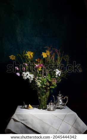 a stylish bouquet of different wild flowers with lilies on a dark background. Still life in the style of old Dutch masters of painting. Large format for printing paintings in the interior.