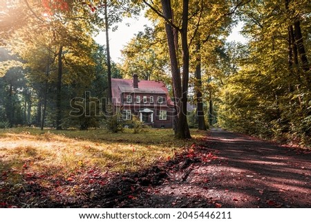 beautiful historic villa built for the American colony in 1927-1927. Brick architecture in the Anglo-Saxon style entered in the register of monuments, surrounded by a beautiful park. Katowice, Poland Royalty-Free Stock Photo #2045446211