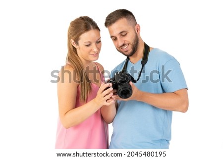 Young couple looking at the camera photo results