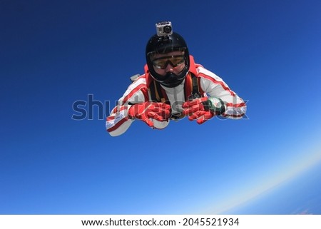 The parachutist is engaged in skydiving. Royalty-Free Stock Photo #2045521934