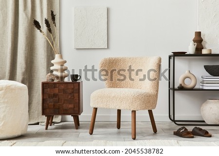 Stylish living room interior design composition with mock up structure painting, fluffy armchair, commode and personal accessories. Modern classic style. Template. Royalty-Free Stock Photo #2045538782