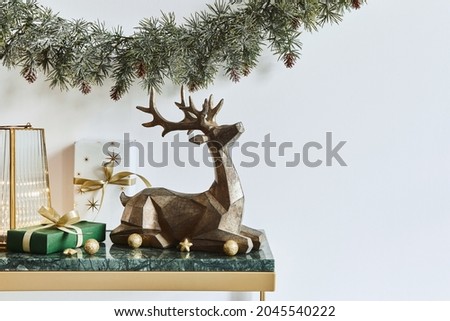 Christmas composition with beautiful decoration, christmas tree and wreath, deer, gifts and accessories in modern home decor. Template.