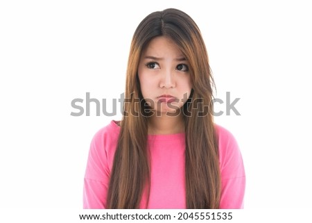 Unhappy young Asian woman annoyed angry with blank copy space  ,concept negative emotions and facial expression,Portrait of Asian woman,isolated on white background