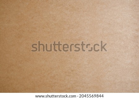 Fiberboard (MDF) surface. Recycled wood texture. Wooden surface of a fibreboard d sheet, top view. Brown hardboard texture background. 
