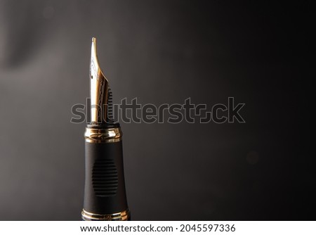 Fountain pen, beautiful details of a beautiful fountain pen, dark gradient background, selective focus.