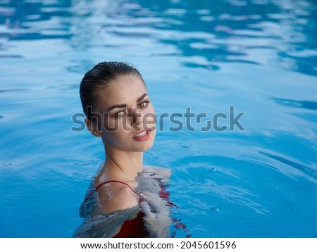 woman in a swimsuit in the pool vacation luxury close-up nature