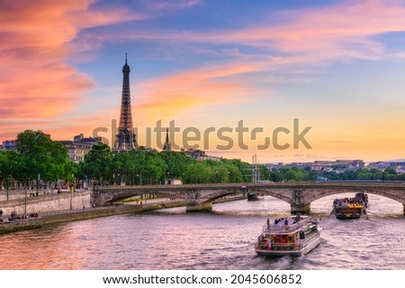 Sunset view of Eiffel tower and Seine river in Paris, France. Eiffel Tower is one of the most iconic landmarks of Paris. Cityscape of Paris Royalty-Free Stock Photo #2045606852