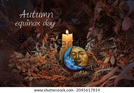 Autumn equinox day. burning candle, amulet of sun and moon in autumn leaves, abstract dark background. pagan Wiccan, Slavic traditions. Witchcraft, esoteric spiritual practice. magic ritual. Royalty-Free Stock Photo #2045617814