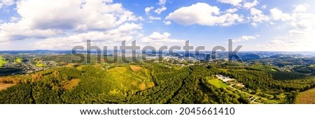 the landscape of the siegerland with the city siegen in the background panorama Royalty-Free Stock Photo #2045661410