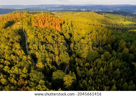 the landscape of the siegerland with the city siegen in the background Royalty-Free Stock Photo #2045661416