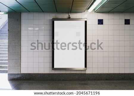 Indoor outdoor city light mall shop template. Blank billboard mock up in a subway station, underground interior. Urban light box inside advertisement metro airport vertical. Royalty-Free Stock Photo #2045671196