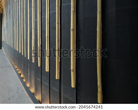 modern style pattern nature background of  brown handicraft weave texture bamboo surface for decorative wall with black steel structure.