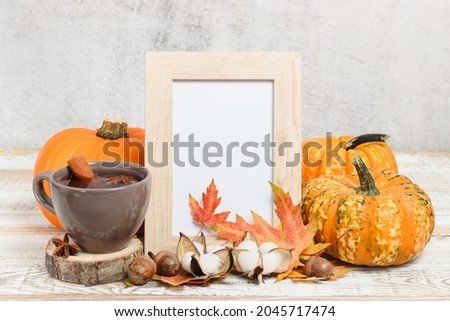 Photo frame mockup with tea and pumpkins. Autumn mockup frame with copy space
