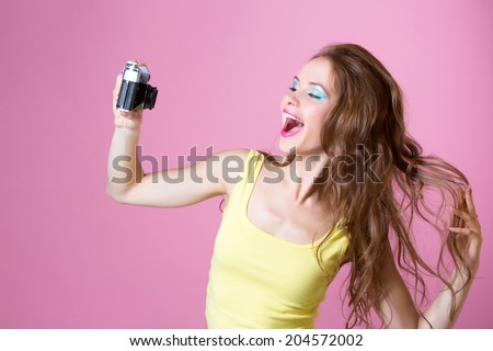 Selfie. Beautiful girl posing in front of the camera and doing a self-portrait.