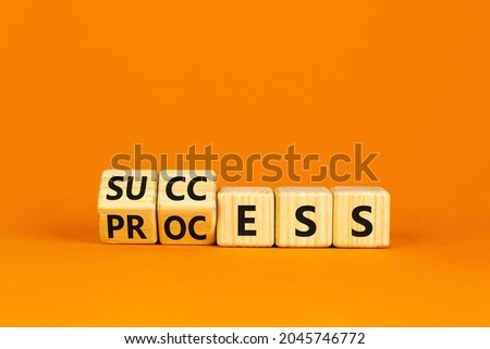 Success business process symbol. Turned wooden cubes with words 'success process'. Beautiful orange background, copy space. Success business process concept. Royalty-Free Stock Photo #2045746772
