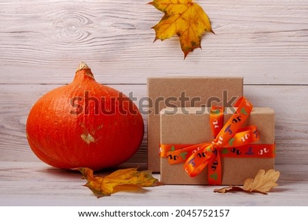 Selective focus of halloween gifts and pumpkin
