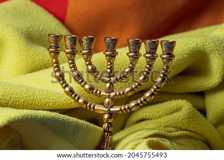 Jewish festive metal seven-candlestick with gilding