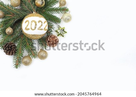 Happy New Year 2022. Christmas decorations, creative minimal background with new year toys, balls and pine cones, greeting cards, banner for display, product customization for holiday advertising