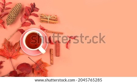 Autumn composition flat lay, seasonal background with maple leaves, cinnamon and tea, place for text. Happy Thanksgiving concept, greeting card, banner for screen, top view,