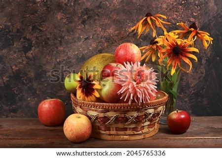 Autumn harvest concept, old wooden table with pumpkins, melons, apples, pears and grapes, thanksgiving day background, healthy ecological food, rustic style, selective focus