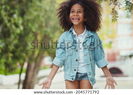 Little girl full of happines and excitement. Outdoor picture.