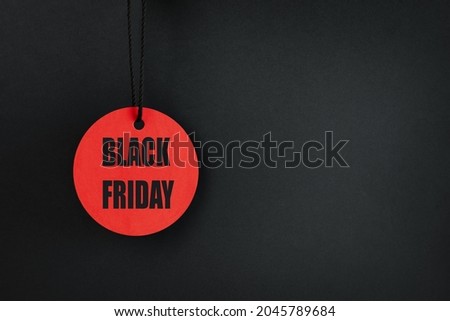 one circle red tag on a black background with the inscription Black Friday