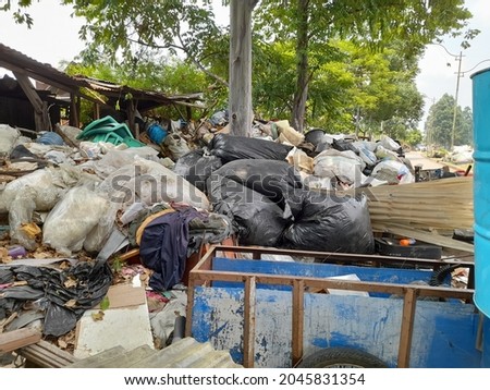 plastic waste and white sacks in bkt (banjir kanal timur).background concept of caring for the environment, slums, government regulations, scavengers, recycle, garbage collectors, industrial, industry
