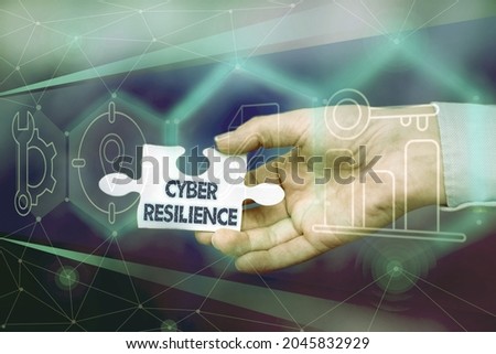 Conceptual caption Cyber Resilience. Word for measure of how well an enterprise can manage a cyberattack Hand Holding Jigsaw Puzzle Piece Unlocking New Futuristic Technologies.