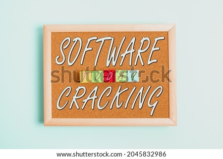 Sign displaying Software Cracking. Business concept modification of software to remove or disable features Stack of Sample Cube Rectangular Boxes On Surface Polished With Multi-Colour