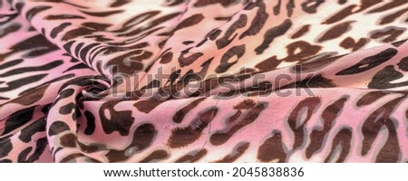 pink silk fabric, leopard print, animal skin, African theme. texture, background, pattern,