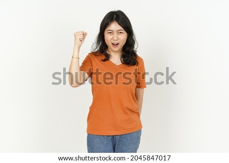 Angry Expression Gesture of beautiful asian woman Wearing orange T-shirt isolated on white background