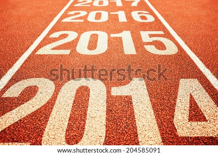 Number 2015 on athletics all weather running track withe preceeding and following years. Happy new 2015 year. Running fast towards New Year. Royalty-Free Stock Photo #204585091