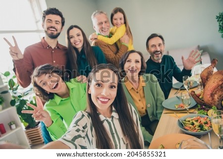 Self-portrait of attractive cheerful big full family meeting showing v-sign good mood having fun at home indoors Royalty-Free Stock Photo #2045855321