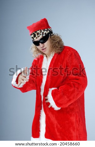 Santa Claus with long hair and sunglasses singing a rap or hip-hop
