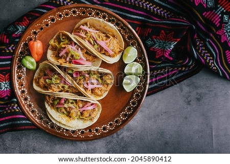 mexican tacos flat lay composition with pork carnitas, cochinita pibil, onion and habanero chili traditional food in Mexico Royalty-Free Stock Photo #2045890412